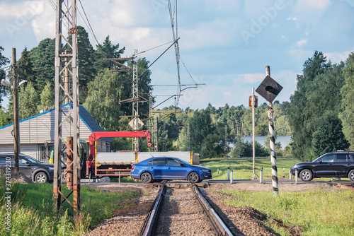 Cars cross the railroad track. photo