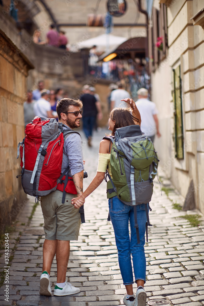 couple walking outdoors at the city street.Travel, tourism and people concept. .