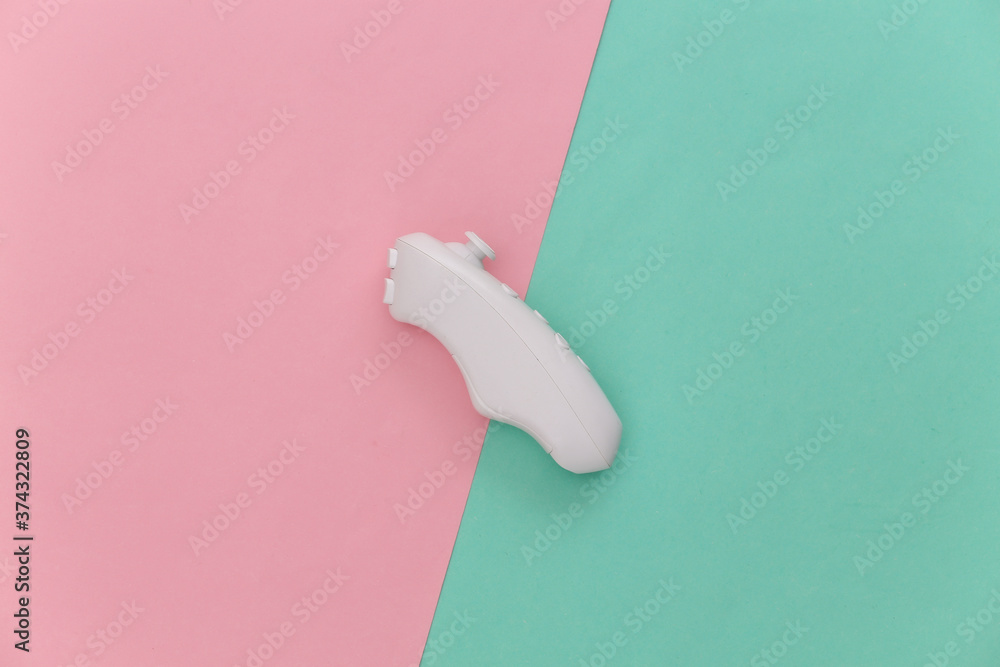 Modern controller (joystick) on a blue-pink pastel background. Top view. Gadgets and devices. Flat lay Modern controller (joystick) on a blue-pink pastel background. Top view. Gadgets and devices. Flat lay