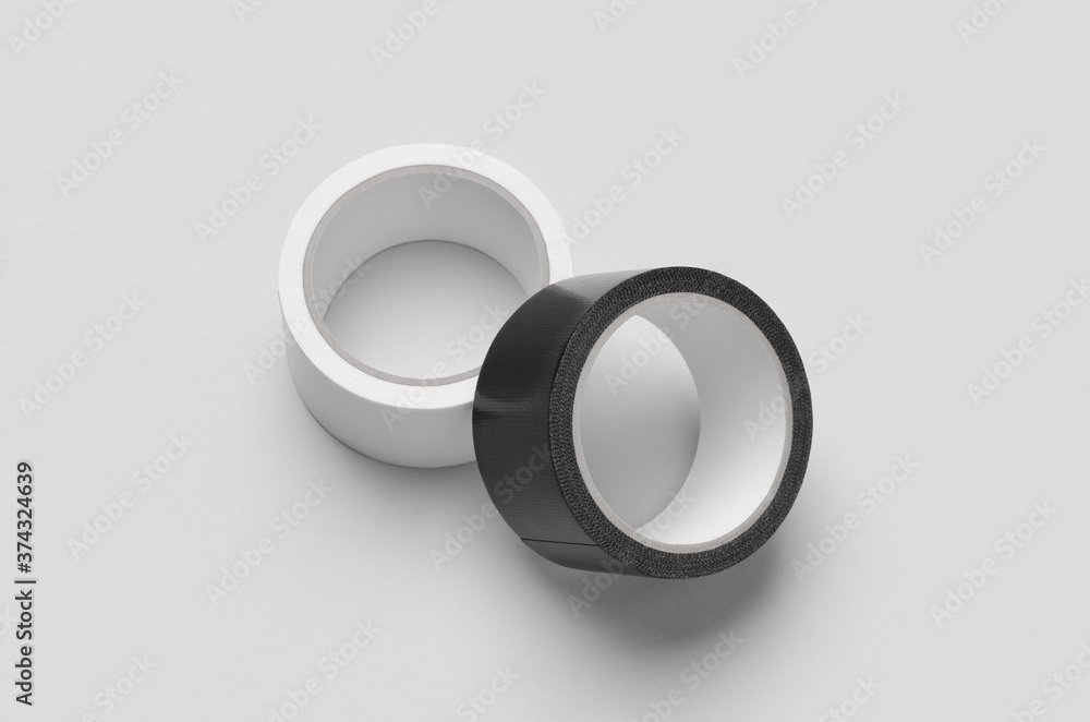 White and black duct tapes mockup on a grey background. White and black duct tapes mockup on a grey background.