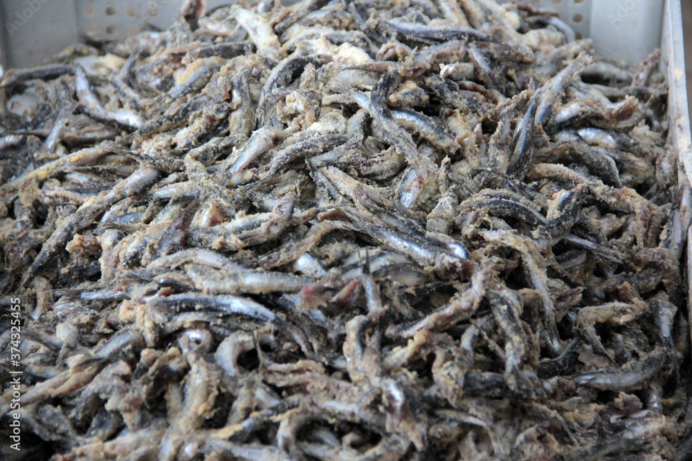 Anchovies are fried in vegetable oil in a pan. Anchovies are fried in vegetable oil in a pan.
