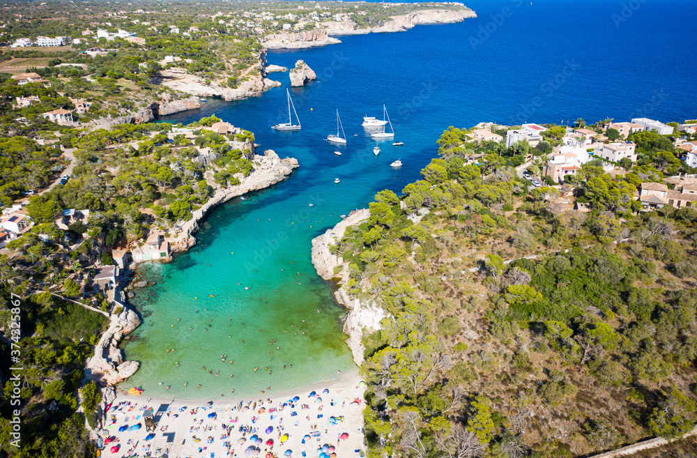 aerial view of a beautiful white sandy beach on Mallorca, Cala Llombards, Spain