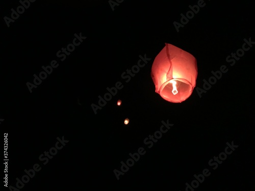 burning candle on black background