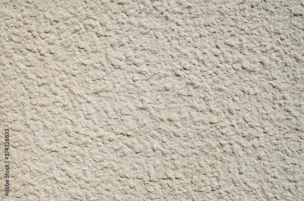 New ecru stone on wall closeup New ecru stone on wall closeup