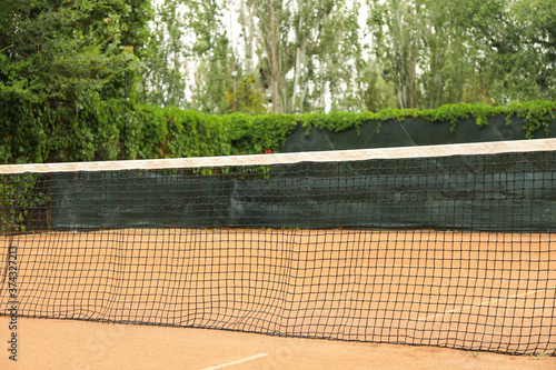 Wallpaper Mural Clay tennis court with net, space for text Torontodigital.ca