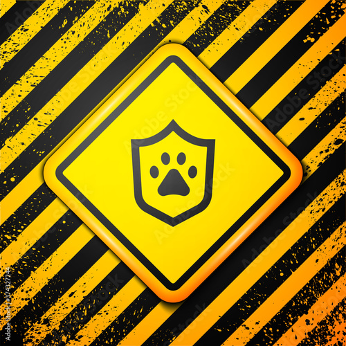Black Animal health insurance icon isolated on yellow background. Pet protection concept. Dog or cat paw print. Warning sign. Vector.