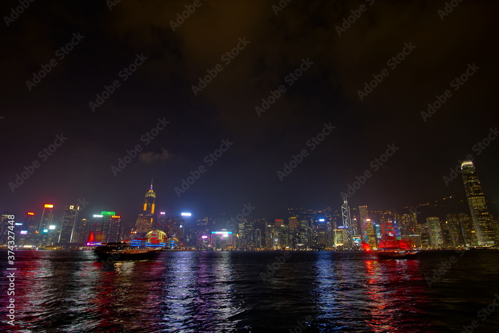 City landscape. Victoria Harbor and Hong Kong skyscrapers at night. City landscape. Victoria Harbor and Hong Kong skyscrapers at night.