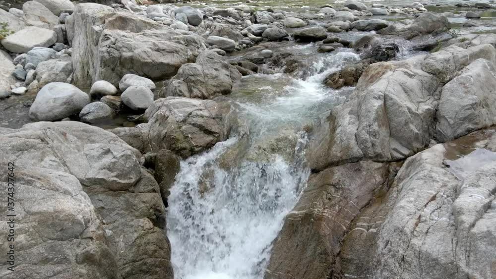 water flowing into the rocks water flowing into the rocks