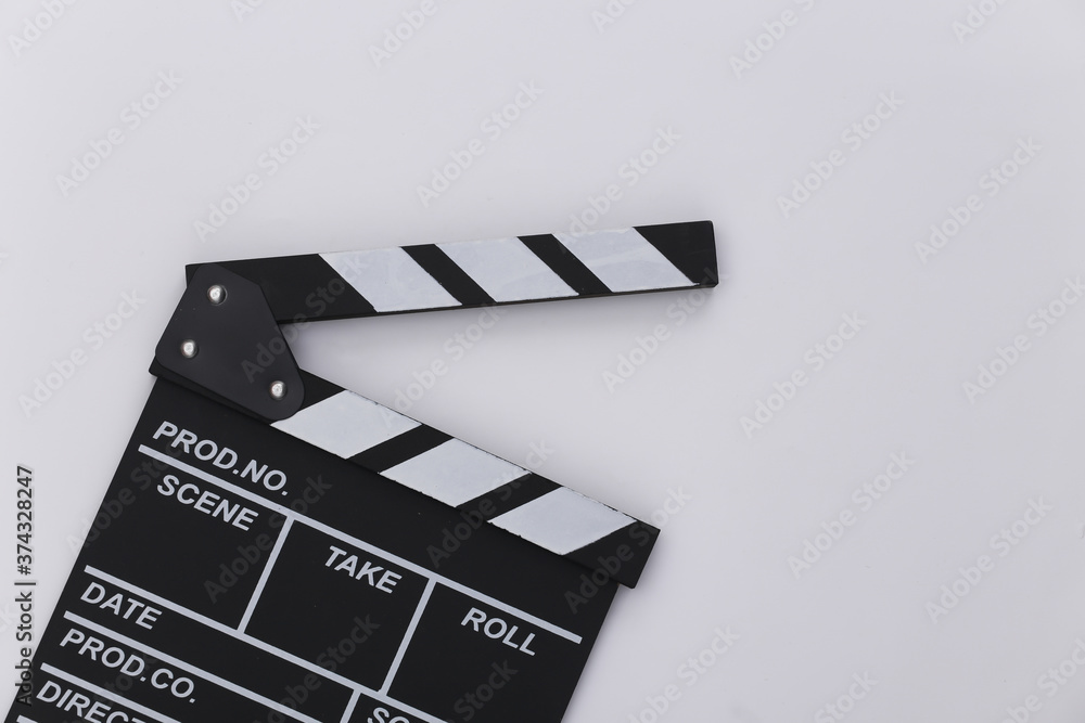 Movie clapper board on white background. Filmmaking, Movie production, Entertainment industry. Top view