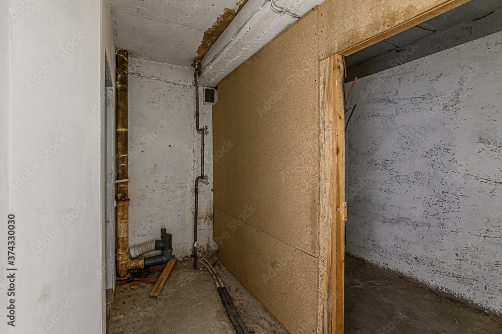 Russia, Moscow- February 15, 2020: interior room rough repair for self-finishing. interior decoration, bare walls of the premises, stage of construction