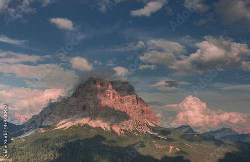 Monte Pelmo at sunset, isolated mountain, resembling a giant trapezoid, as seen from Rifugio Coldai, stage seven of Alta Via 1 classic trek in the Dolomites, province of Belluno, South Tirol, Italy. photo