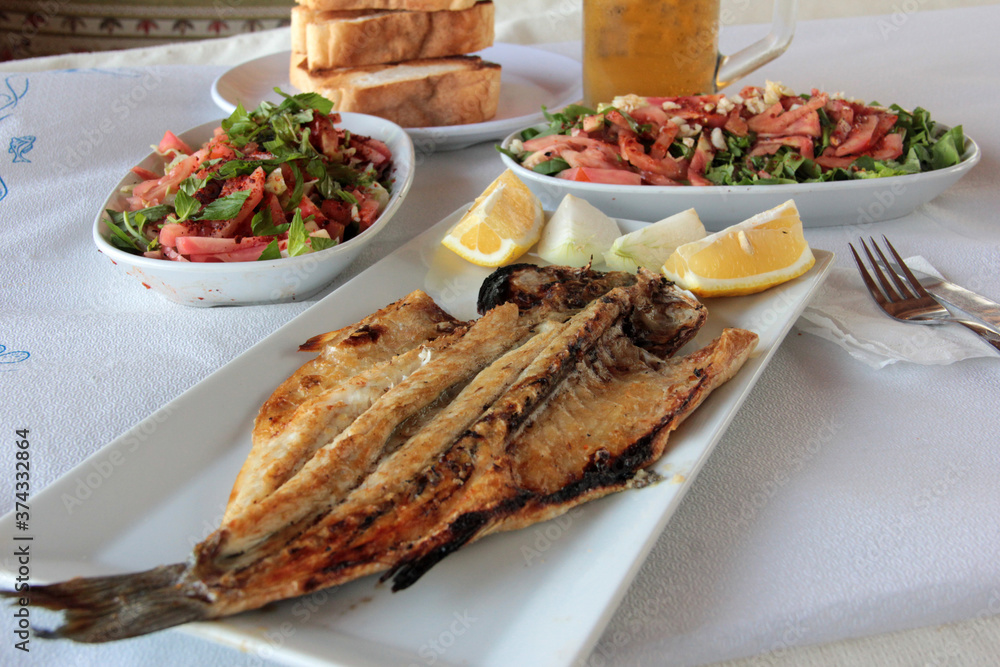 delicious fish and salads on presentation plate delicious fish and salads on presentation plate