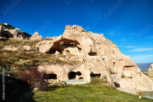 Funny and strange Cappadocia rock houses in Goreme in Anatolia, Turkey. Ruins of ancient city. The concept of the historic voyage