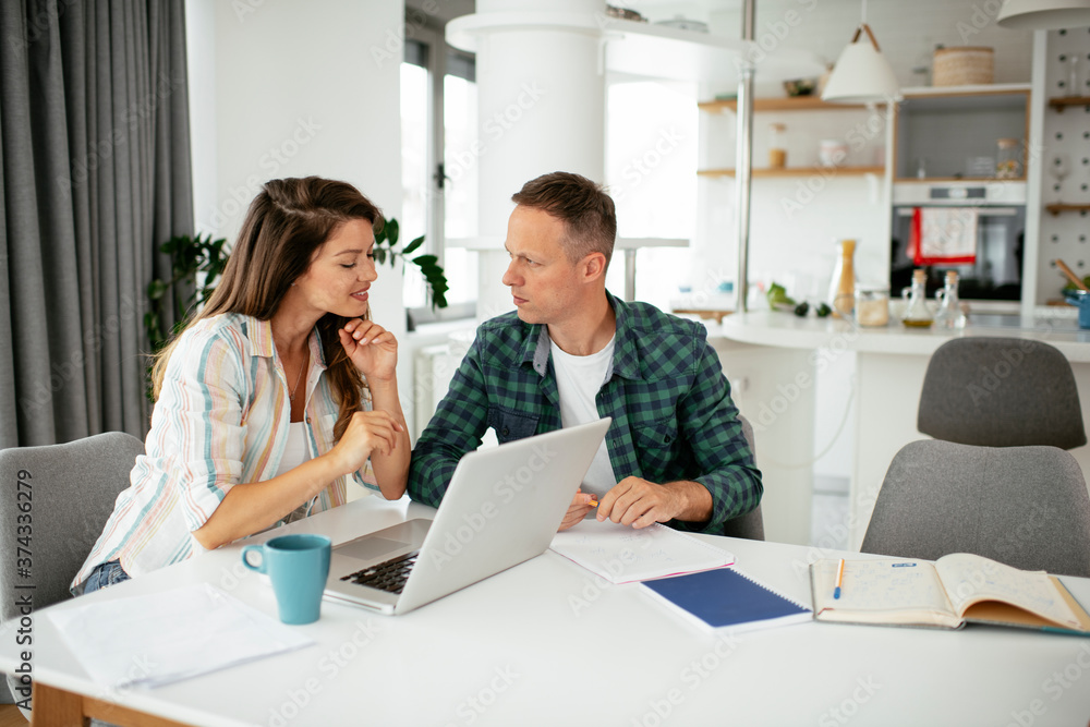 Husband and wife preparing bills to pay. Young couple having financial problems.. Husband and wife preparing bills to pay. Young couple having financial problems..