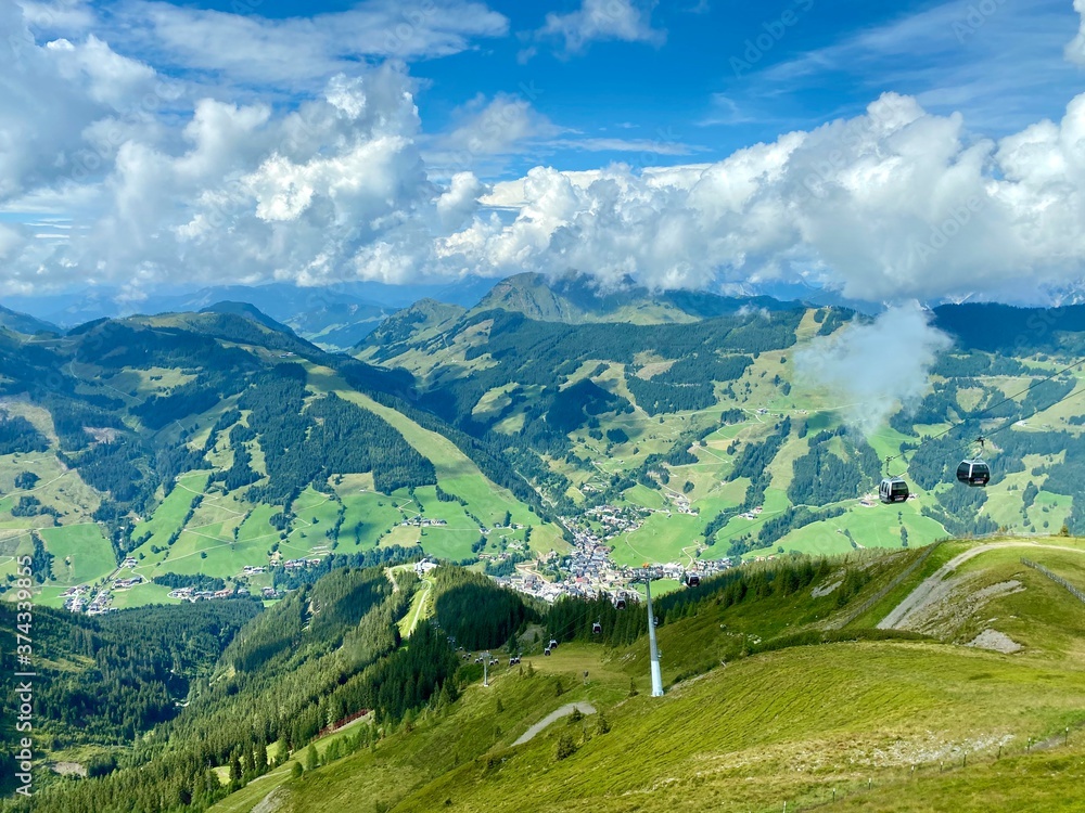 View on Saalbach village and mountains in Saalbach-Hinterglemm skiing region in Austria on a beautiful summer day. View on Saalbach village and mountains in Saalbach-Hinterglemm skiing region in Austria on a beautiful summer day.