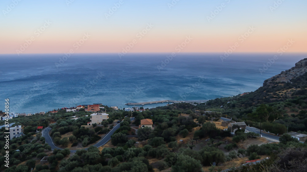 Libyan sea and road with bends at the sunset seen from Great Sea View, Viannos, Greece