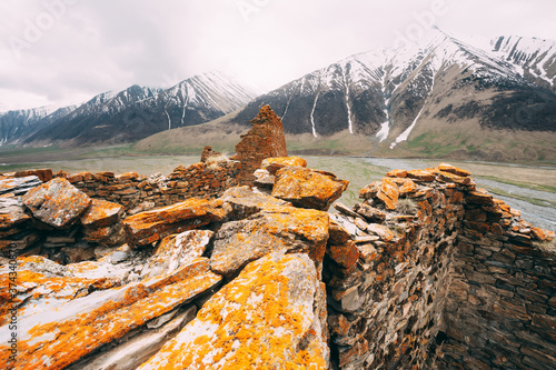 Fortress On Mountain Background Near Karatkau Village, Kazbegi District, Mtskheta-Mtianeti Region, Georgia. Spring, Summer Season. Truso Gorge. photo