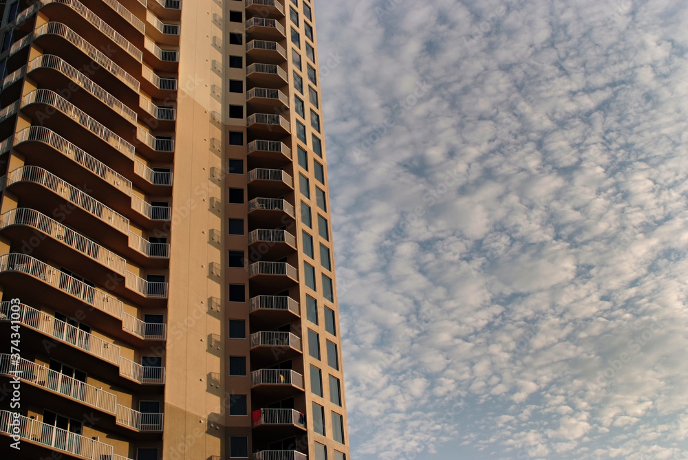 Fototapeta premium Building with windows against clouds