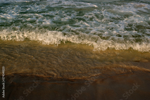 Fototapeta Naklejka Na Ścianę i Meble -  Golden waves and sand