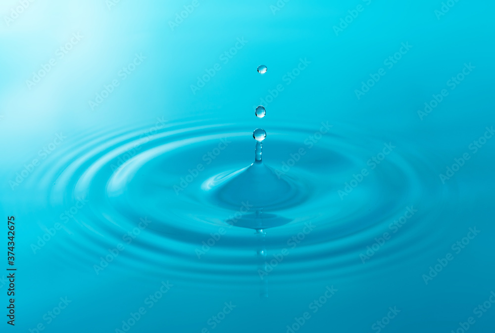 Close-up blue water drops isolated on white background. Close-up blue water drops isolated on white background.