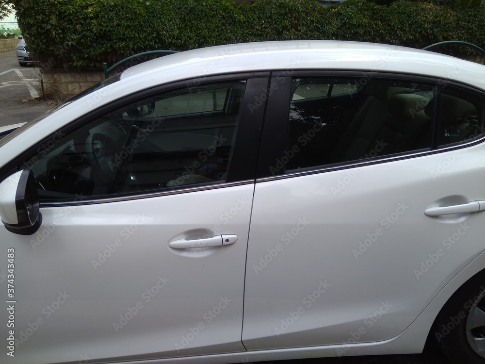 White car side view close up. White car side view close up.