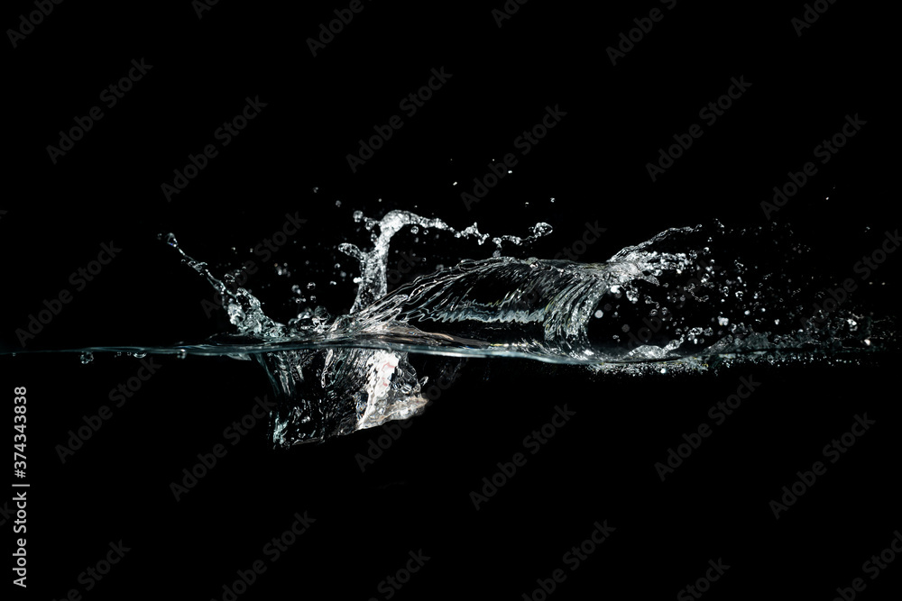 close up of water waves splash and bubbles isolated on black background. close up of water waves splash and bubbles isolated on black background.