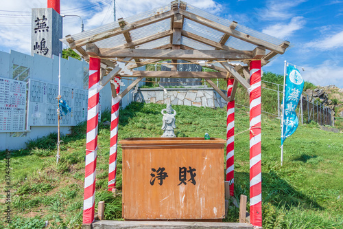 The Kabushima shrine is a picturesque shrine located on a small hill surrounded by the sea at Same,Hachinohe, Aomori,Japan. photo