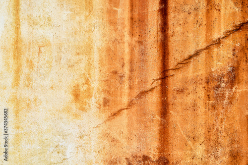 Outdoor cement wall stained with rust.