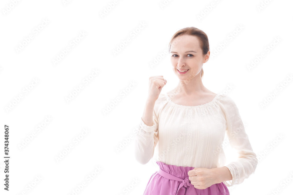 ガッツポーズをする若い女性 ガッツポーズをする若い女性