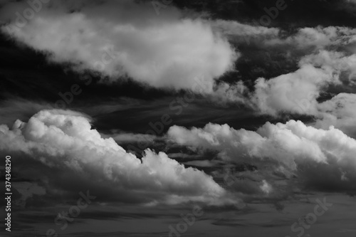 black and white contrasted clouds on the sky
