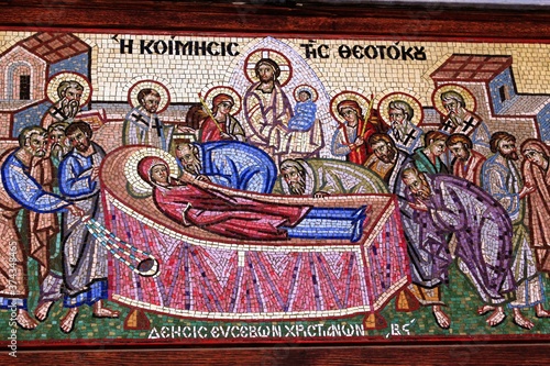 Beautiful mosaic showing the Dormition of the Virgin Mary outside of a Christian orthodox church - Athens, Greece, August 11 2020.