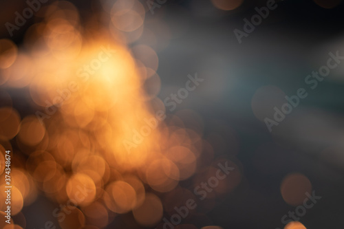 Gold abstract bokeh background, Festive xmas abstract background with bokeh defocused lights and stars
