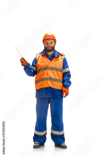 Handsome contractor, builder isolated over white studio background. Concept of professional occupation, work, job, building, investment. Copyspace for ad, text. Caucasian man wearing equipment.