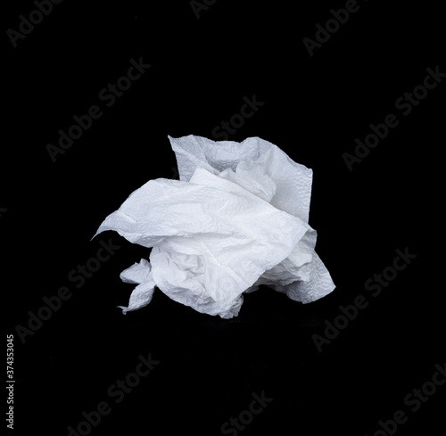 Crumpled tissue paper isolated on black background texture