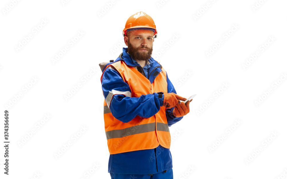 Handsome contractor, builder in face mask isolated over white studio background. Concept of professional occupation, work, job, building, investment. Copyspace for ad, text. Caucasian man wearing Handsome contractor, builder in face mask isolated over white studio background. Concept of professional occupation, work, job, building, investment. Copyspace for ad, text. Caucasian man wearing