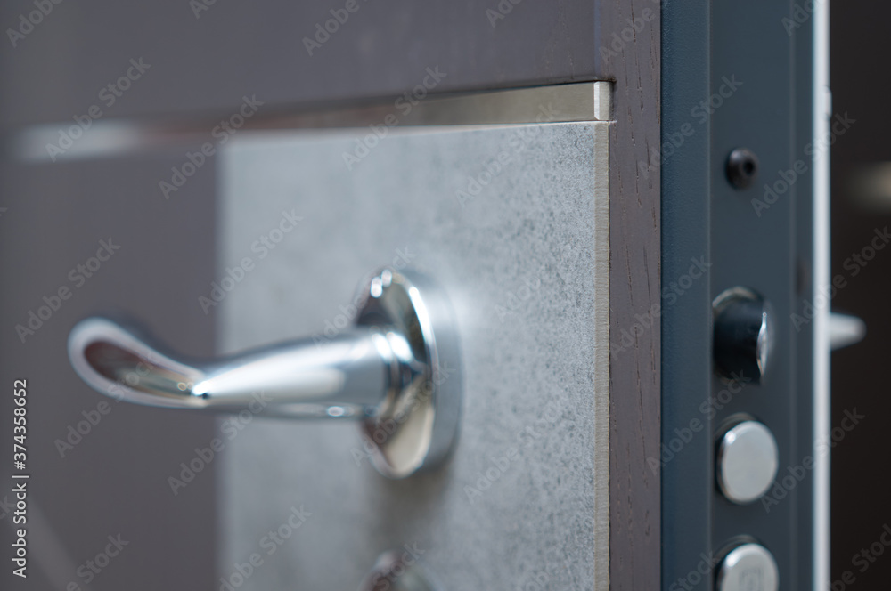 Handle details entrance door finished with wood veneer aтв stone blue steel color Handle details entrance door finished with wood veneer aтв stone blue steel color