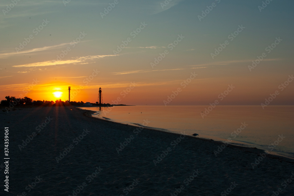 Beautiful sea sunrise with lighthouses. lighthouse on Dzharylgach island, Kherson region. Old lighthouse on the seaside in Ukraine. Beautiful sea sunrise with lighthouses on Dzharylgach island.