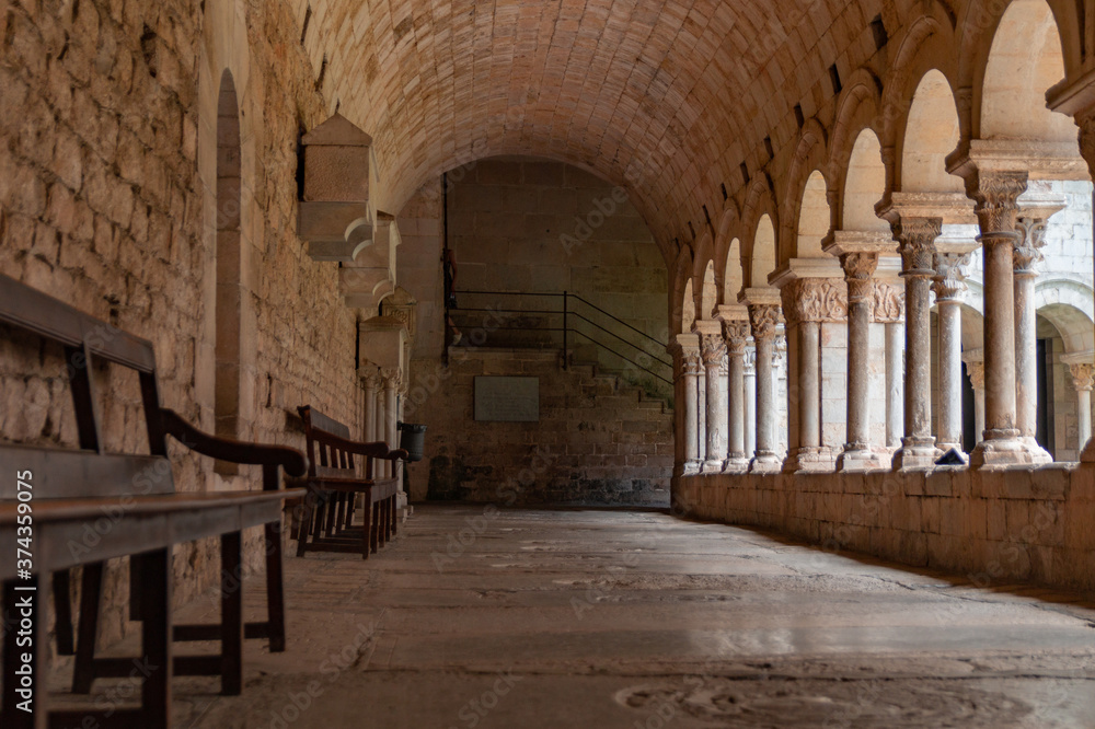 Fototapeta premium Old arched corridor in a cathedral