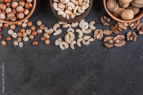 Walnut, hazelnut and cashews in pottery, view from above