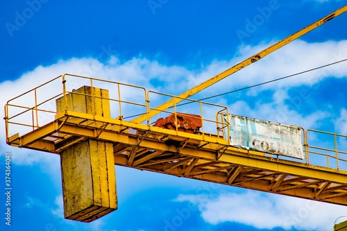 yellow crane on blue sky