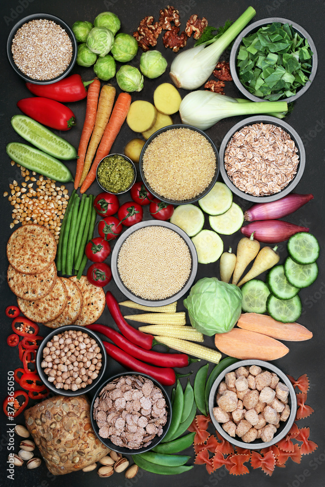 Vegan food for health and fitness with foods high in protein, vitamins, minerals, anthocyanins, omega 3, antioxidants, smart carbs and dietary fibre. Healthy ethical eating concept. Flat lay.
