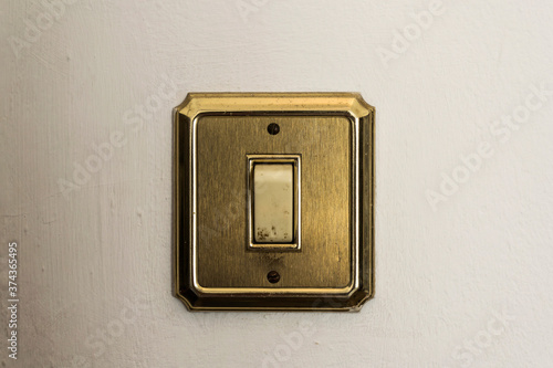 Canvastavla Golden switch on white background