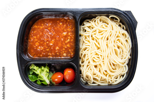 Spaghetti Tomato Sauce, black plastic food container ordered online, eat at home, isolated on white background.