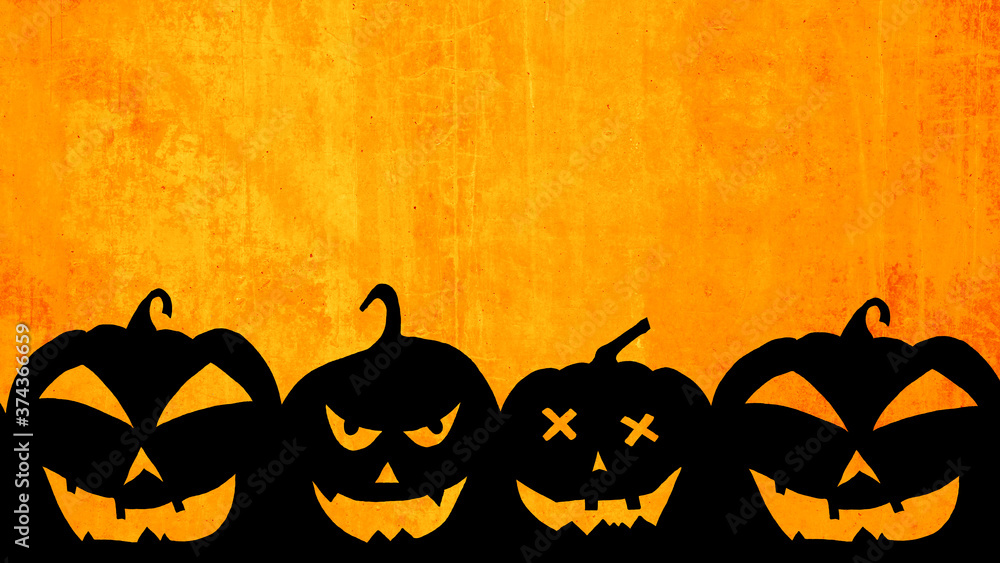 Fototapeta premium HALLOWEEN background template -Silhouette of scary carved luminous cartoon pumpkins isolated on abstract grunge orange texture