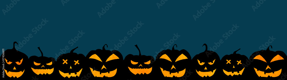 Naklejka premium HALLOWEEN background banner wide panoramic panorama template -Silhouette of scary carved luminous cartoon pumpkins isolated on dark blue texture