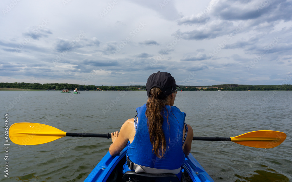 female kayaker on Lake Woblitz enjoys a day on the water