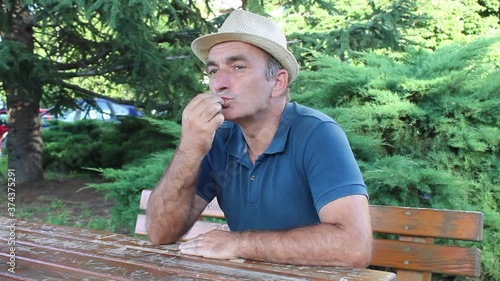 Middle Age Man Kissing His Fingers With Meaning That Something is Excellent
