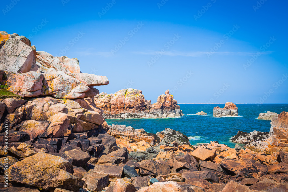 Colourful rocks at the lle de Brehat off the coast of Brittany, France