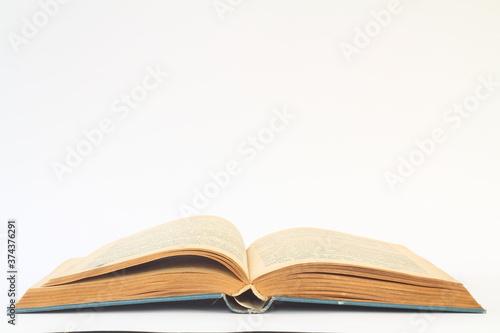 White opened book with blank pages.