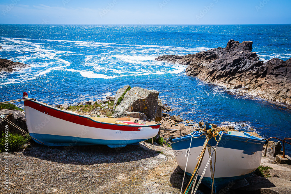 Fishing boats at the rocky coast of Brittany, France
